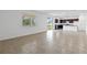 Spacious living area with tile floor, access to patio, and kitchen view at 9034 Sandy Bluffs Cir, Parrish, FL 34219