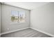 Simple bedroom with a window and carpet flooring at 101 Runaway Field Ave, Nokomis, FL 34275