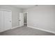 Spacious bedroom featuring gray carpet and an ensuite bathroom at 101 Runaway Field Ave, Nokomis, FL 34275