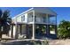 Elevated home with white exterior, balcony, and open floor plan at 2445 Tamworth Ter, Punta Gorda, FL 33983
