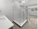 Modern bathroom with marble shower and gray vanity at 4104 W Gray St, Tampa, FL 33609