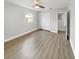 Light and airy bedroom with wood-look floors and ceiling fan at 4104 W Gray St, Tampa, FL 33609