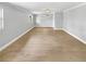 Spacious bedroom with wood-look floors and a window at 4104 W Gray St, Tampa, FL 33609