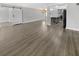 Open living space with hardwood floors and a view of the kitchen at 4104 W Gray St, Tampa, FL 33609