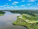 Aerial view of waterfront property and surrounding landscape at 9573 Shelburne Cir, Port Charlotte, FL 33981