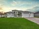 Attractive single-story home with three-car garage and well-manicured lawn at 287 Mariner Ln, Rotonda West, FL 33947