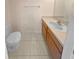 Bathroom with single vanity and beige tile floors at 8882 Christie Dr, Largo, FL 33771