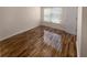 Bedroom with hardwood floors and window coverings at 8882 Christie Dr, Largo, FL 33771