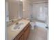 Clean bathroom featuring a tub, toilet and vanity at 8882 Christie Dr, Largo, FL 33771