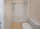 Bathroom with shower, toilet, and beige tile floors at 8882 Christie Dr, Largo, FL 33771