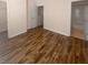 Spacious bedroom with wood-look flooring and an ensuite bathroom at 8882 Christie Dr, Largo, FL 33771