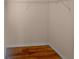 Walk-in closet with wire shelving and wood flooring at 8882 Christie Dr, Largo, FL 33771