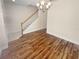 Dining room featuring hardwood floors and a chandelier, near staircase at 8882 Christie Dr, Largo, FL 33771