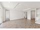 Spacious living room with tile flooring and ample natural light at 9584 Vibrant Lane, Venice, FL 34292