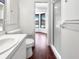 Bathroom featuring modern fixtures, a walk-in shower, and a view of the pool area at 7087 Spinnaker Blvd, Englewood, FL 34224