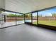 Screened patio overlooking a private backyard with a refreshing swimming pool at 7087 Spinnaker Blvd, Englewood, FL 34224