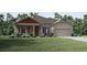Charming one-story house with a red roof and stone accents at 16323 Navarro Ct, Punta Gorda, FL 33955