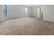 Large bedroom with neutral carpet and paint and a big window at 3524 Cessna St, Port Charlotte, FL 33948