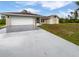 Charming single story home featuring a two-car garage and a well-manicured front yard at 3524 Cessna St, Port Charlotte, FL 33948