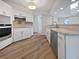 Modern kitchen with white cabinets, stainless steel appliances, and light countertops at 3524 Cessna St, Port Charlotte, FL 33948