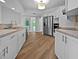 Modern kitchen featuring stainless steel appliances, granite countertops, and updated cabinets at 3524 Cessna St, Port Charlotte, FL 33948
