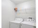 Laundry room with washer, dryer, and shelving at 20453 Berrywood Ln, Tampa, FL 33647