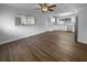 Bright kitchen features stainless appliances, white cabinets, granite counters, and wood floors at 4409 W Leila Ave, Tampa, FL 33616
