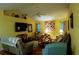 Comfortable living room with vaulted ceilings and hardwood floors at 4202 Perch Cir, Port Charlotte, FL 33948