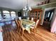 Formal dining room featuring hardwood floors and a large dining table at 4202 Perch Cir, Port Charlotte, FL 33948