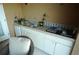 Outdoor kitchen with sink, grill, and countertop at 4202 Perch Cir, Port Charlotte, FL 33948
