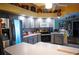 Modern kitchen with gray cabinets, stainless steel appliances, and ample counter space at 4202 Perch Cir, Port Charlotte, FL 33948
