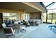 Outdoor patio with seating area and adjacent pool and kitchen at 4202 Perch Cir, Port Charlotte, FL 33948