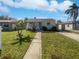 Charming single-story home with a well-maintained lawn and inviting walkway at 548 47Th N Ave, St Petersburg, FL 33703