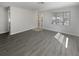 An empty living room with new vinyl flooring, offering a clean, modern space at 548 47Th N Ave, St Petersburg, FL 33703