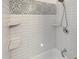 Stylish renovated shower with white subway tile and decorative accents at 548 47Th N Ave, St Petersburg, FL 33703