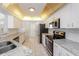 Modern kitchen featuring granite countertops and stainless steel appliances at 1090 Yarmouth St, Port Charlotte, FL 33952