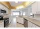Well-equipped kitchen with granite countertops and ample cabinet space at 1090 Yarmouth St, Port Charlotte, FL 33952
