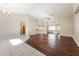 Open living area with high ceilings, wood floors, and sliding doors at 1090 Yarmouth St, Port Charlotte, FL 33952