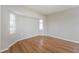 Well-lit bedroom featuring hardwood floors and a window at 1090 Yarmouth St, Port Charlotte, FL 33952