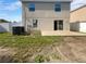 Spacious backyard with a concrete patio and lush green lawn, perfect for outdoor activities at 3444 97Th E Ln, Palmetto, FL 34221
