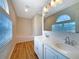 Well-lit bathroom featuring double sinks, a soaking tub, and modern fixtures at 3444 97Th E Ln, Palmetto, FL 34221