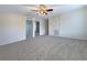 Spacious bedroom featuring neutral carpeting and a ceiling fan at 3444 97Th E Ln, Palmetto, FL 34221