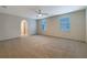 Spacious bedroom with carpet, ceiling fan, and lots of natural light from two windows at 3444 97Th E Ln, Palmetto, FL 34221