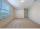 Bedroom with a large window and closet at 3444 97Th E Ln, Palmetto, FL 34221
