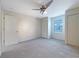 Bedroom featuring carpet floors, ceiling fan, and closet at 3444 97Th E Ln, Palmetto, FL 34221