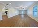 Spacious open-concept living room featuring hardwood floors and abundant natural light at 3444 97Th E Ln, Palmetto, FL 34221