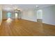 Open-concept living room with hardwood floors and views to other living spaces at 3444 97Th E Ln, Palmetto, FL 34221