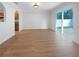 Bright dining room with wood-look floors and sliding glass doors leading to the backyard at 3444 97Th E Ln, Palmetto, FL 34221
