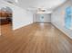 Large living room with hardwood floors and access to the kitchen at 3444 97Th E Ln, Palmetto, FL 34221