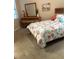 Well-lit bedroom offering soft carpet, a dresser, and a comfortable bed at 23598 Awabuki Dr # 102, Venice, FL 34293